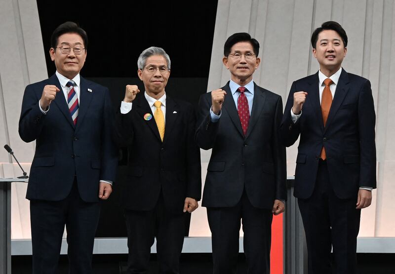 (L to R) South Korea’s presidential candidates, Lee Jae-myung of the Democratic Party, Kwon Young-guk of the Democratic Labor Party, Kim Moon-soo of the People Power Party and Lee Jun-seok of the New Reform Party pose for photographs ahead of the third televised presidential debate for the forthcoming June 3 presidential election on May 27, 2025.